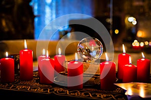 Crystal ball in the candle light to prophesy