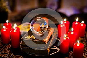Crystal ball in the candle light to prophesy