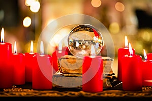 Crystal ball in the candle light to prophesy