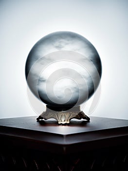 Crystal ball with clouds obscuring the future