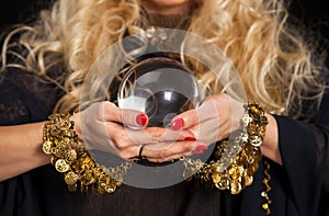 Crystal ball and fortune teller hands.