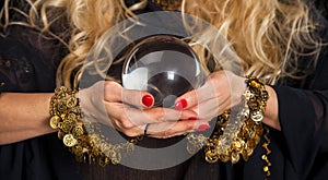 Crystal ball and fortune teller hands.