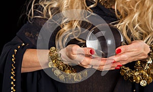 Crystal ball and fortune teller hands.