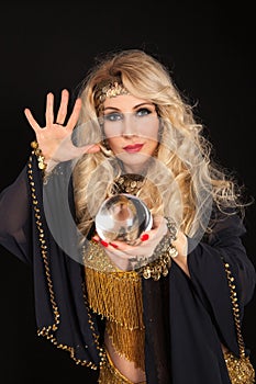 Crystal ball and fortune teller hands.