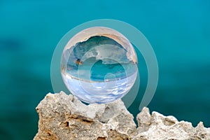 Crystal ball on the rock