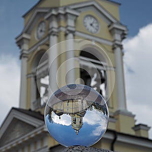 Crystal ball (Spherical lens) and view of the Transfiguration Cathedral. Vyborg