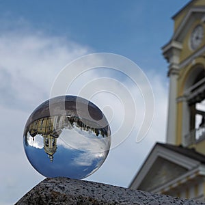 Crystal ball (Spherical lens) and view of the Transfiguration Cathedral. Vyborg