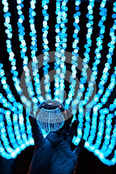 Crystal ball stay in blue garland lights