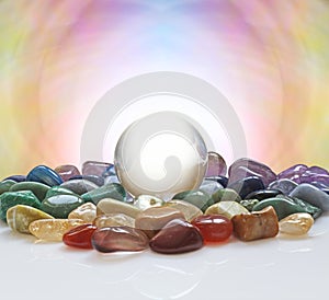 Crystal ball surrounded by healing crystals photo