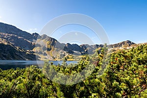 Crystal blue mountain lake Wielki Staw in High Tatra Mountains, Five Polish Ponds Valley, Poland