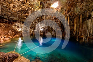 Crystal blue water in Cenote XKeken (XQuequen) in Dzitnup village near Valladolid city - Yucatan Peninsula - Mexico photo