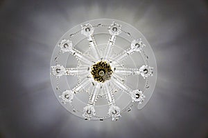 Crystal chandelier on the ceiling, view vertically from the bottom up, pattern, snowflake photo