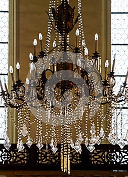 Crystal chandelier lighting in the big majestic hall