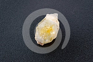 Crystal of Citrine yellow quartz mineral gem stone. Black background