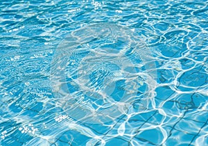 Crystal clear aqua water surface ripples sunlight reflections abstract background
