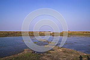 Crystal clear blue water lake landscape view nearby Padma river