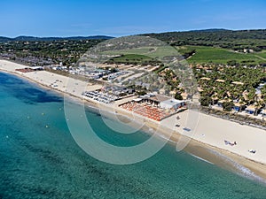 Crystal clear blue water of legendary Pampelonne beach near Saint-Tropez, summer vacation on white sandy beach of French Riviera,