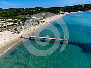 Crystal clear blue water of legendary Pampelonne beach near Saint-Tropez, summer vacation on white sandy beach of French Riviera,