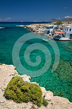 Crystal clear blue water at Mitakas village beach, Milos island, Greece.