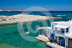 Crystal clear blue water at MItakas village beach, Milos island, Greece.