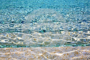 Crystal clear blue water of swimming pool