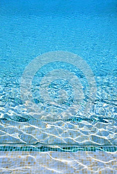 Crystal clear blue water of swimming pool