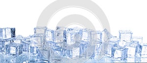 Crystal clear ice cubes with water drops isolated