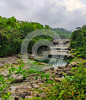 crystal clear rocks and waterfalls in the middle of the mountains of inland asia