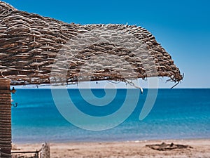 Crystal clear sea water Travel to Red sea, Egypt, blue turquoise Caribbean ocean and one shadow umbrella