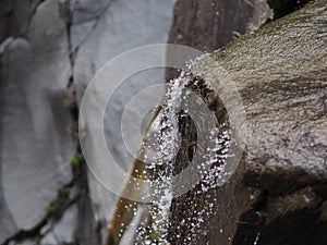 Crystal clear water cascade with drops