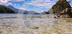 Crystal clear water goes great with blue skies on the wild beach of Mindoro Island!