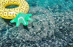 Crystal clear water in the sea lagoon with bright inflatable pin