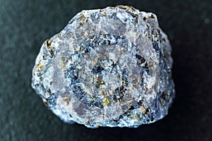 Crystal of cordierite iolite gem stone cutout, raw mineral, close up macro