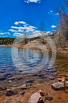 Crystal Creek reservoir near snow-capped mountains Pikes Peak Mountains in Colorado Spring, US