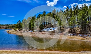 Crystal Creek reservoir near snow-capped mountains Pikes Peak Mountains in Colorado Spring, US