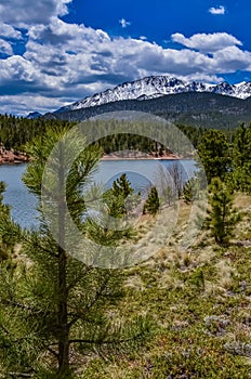 Crystal Creek reservoir near snow-capped mountains Pikes Peak Mountains in Colorado Spring, US