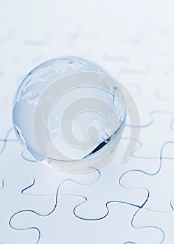 Crystal glass globe ball on puzzle