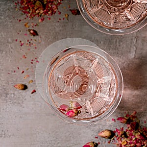 Crystal glasses of pink rose champagne, cider or lemonade
