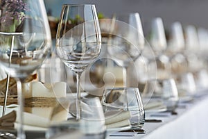 crystal glasses on a served table in a restaurant