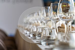 crystal glasses on a served table in a restaurant