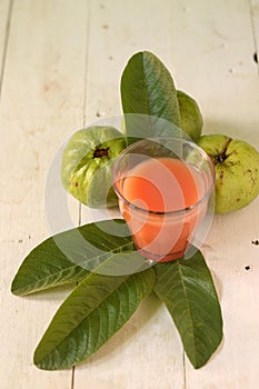 Crystal Guava fruit with leaves isolated on the wooden background