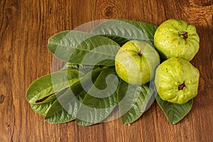 Crystal Guava fruit with leaves isolated on the wooden background