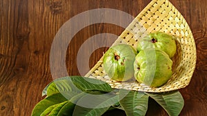 Crystal Guava fruit with leaves isolated on the wooden background