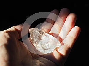 Crystal Healer holding clear quartz