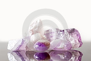 Crystal healing Stone amethyst, uncut and tumble finished photo