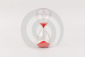 Crystal hourglass on light background as a concept of passing time for business term, urgency and outcome of time
