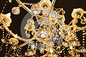 Crystal lamp.Glass chandelier isolated over black background.Cl