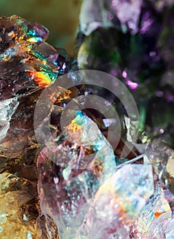 Crystal magic Quartz gem stone. Iridescent crystals. Sparkly texture of specimen with reflected luster light effect.