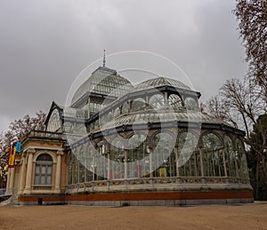 Crystal Palace in Retiro Park in Madrid at dawn on a cloudy day. Concepto viajes