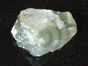 crystal of Prase (green quartz) stone on black